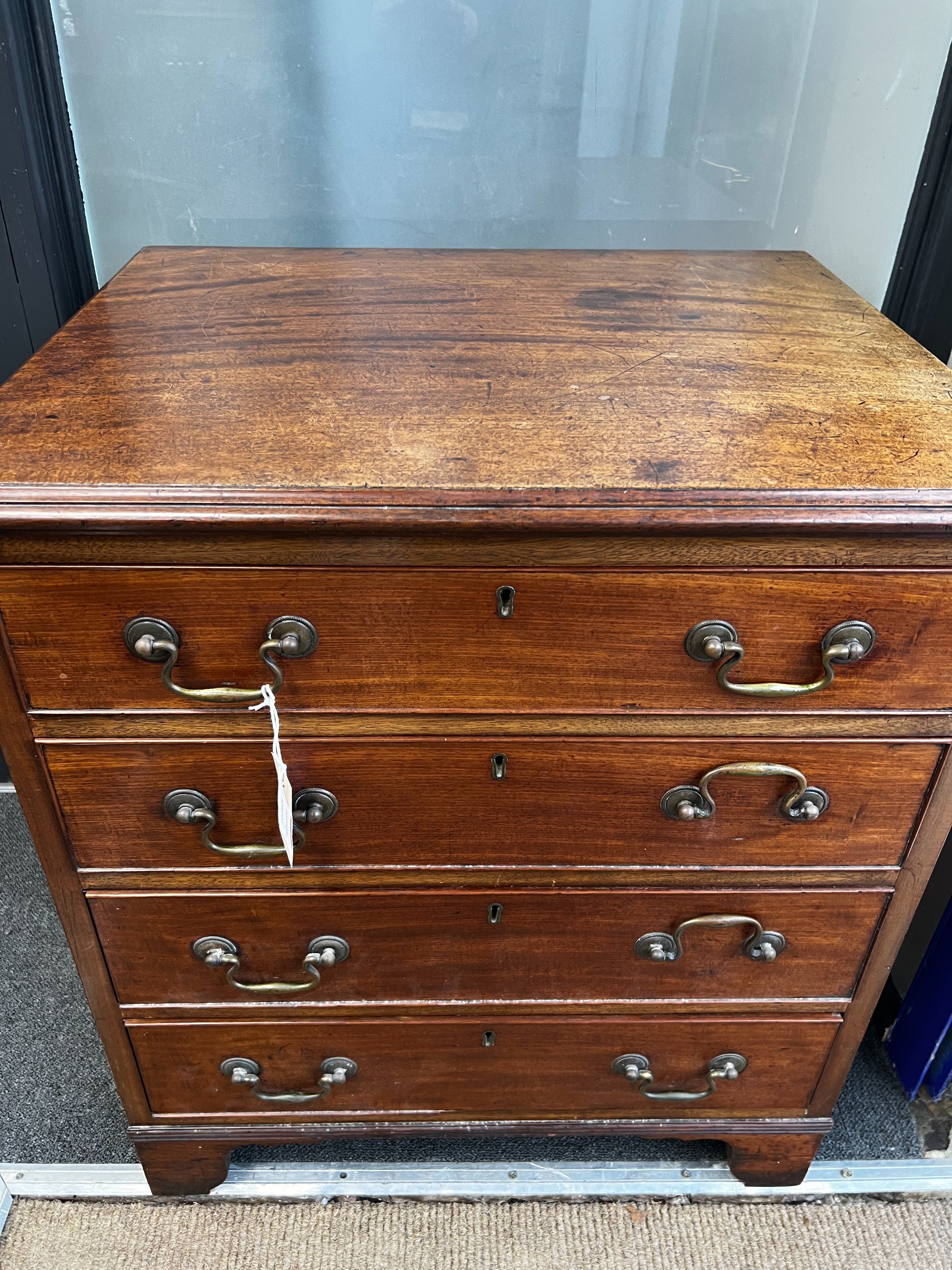 A small George III style mahogany chest of four drawers, width 64cm, depth 51cm, height 74cm